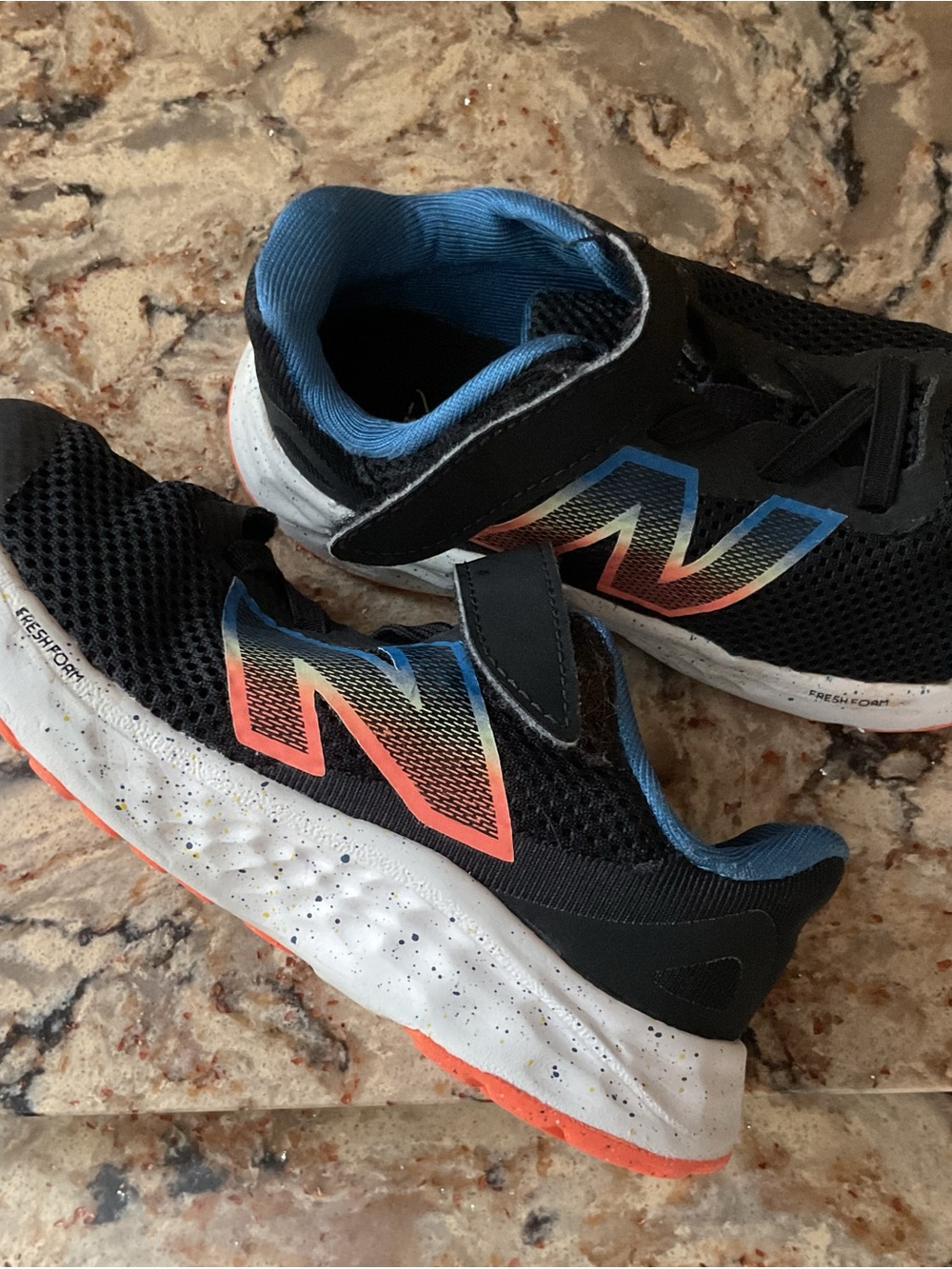 New Balance Kids Black Sneakers with Blue Lining and Coral Accent